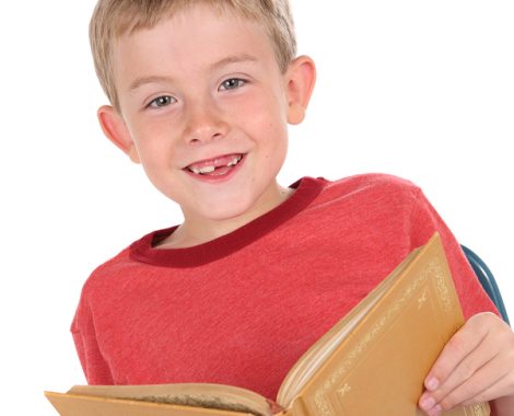 Smiling boy holding a book